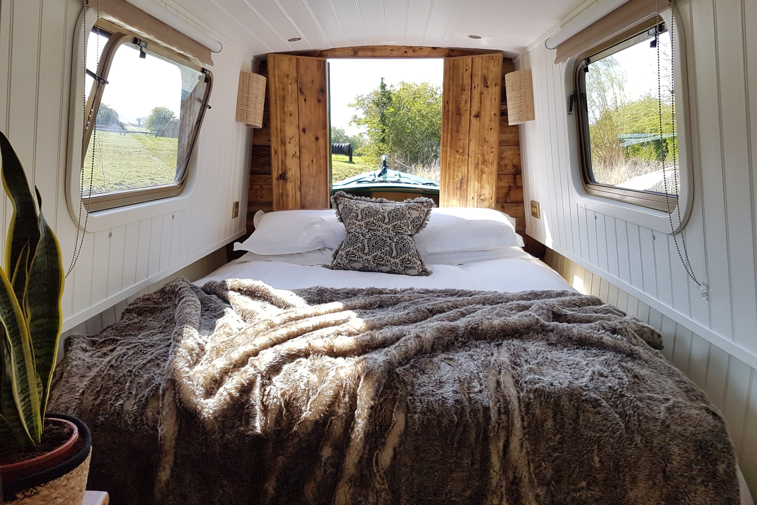 Luxury narrowboat holiday interior with comfortable double bedroom